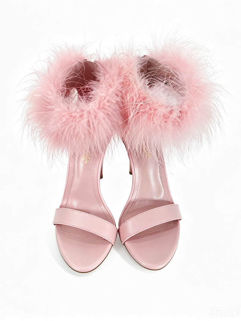 Introducing the Raquel Feather Stiletto Heel by Frederick’s of Hollywood—a striking pair of pink high-heeled sandals adorned with elegant, fluffy feather trim around the ankle, viewed from above on a white background. These statement heels are designed to make an unforgettable impression.