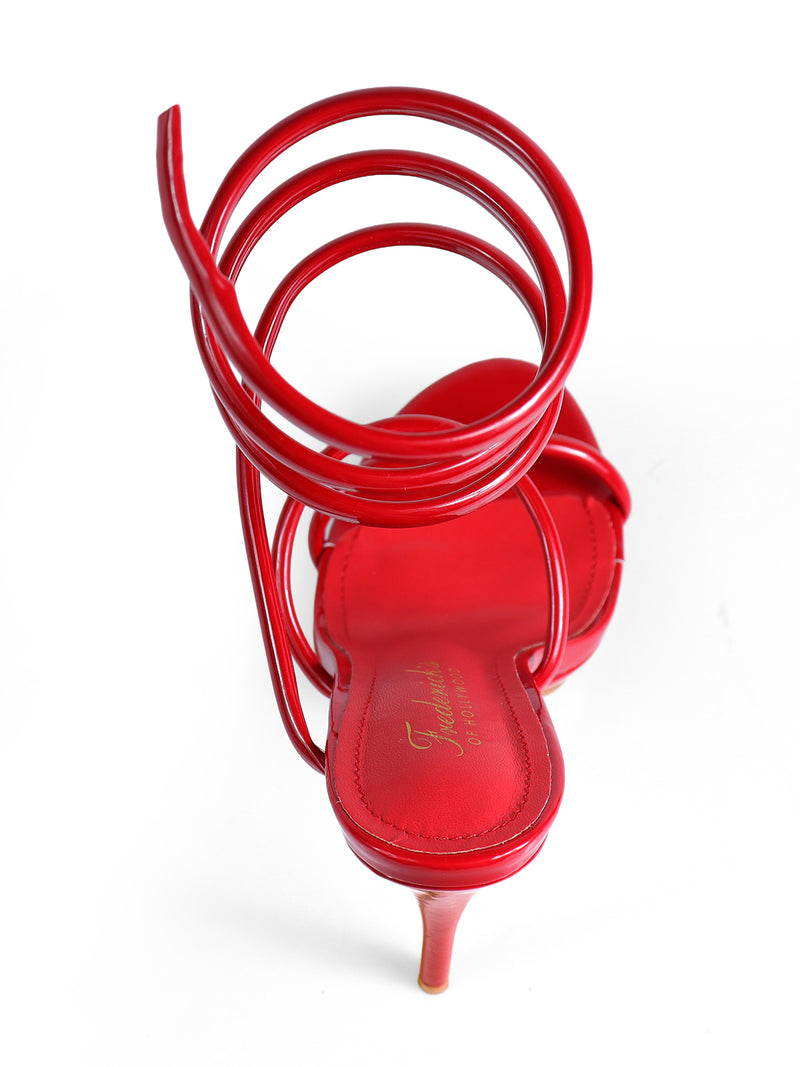 The Sabine Round Toe Heel by Frederick's of Hollywood is a shiny red sandal with a thin high heel and three spiral ankle straps, shown from the back on a white background.