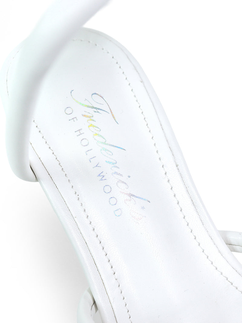 A close-up of the Sabine Round Toe Heel, a white sandal by Frederick's of Hollywood, with the insole featuring the brand name in iridescent script.
