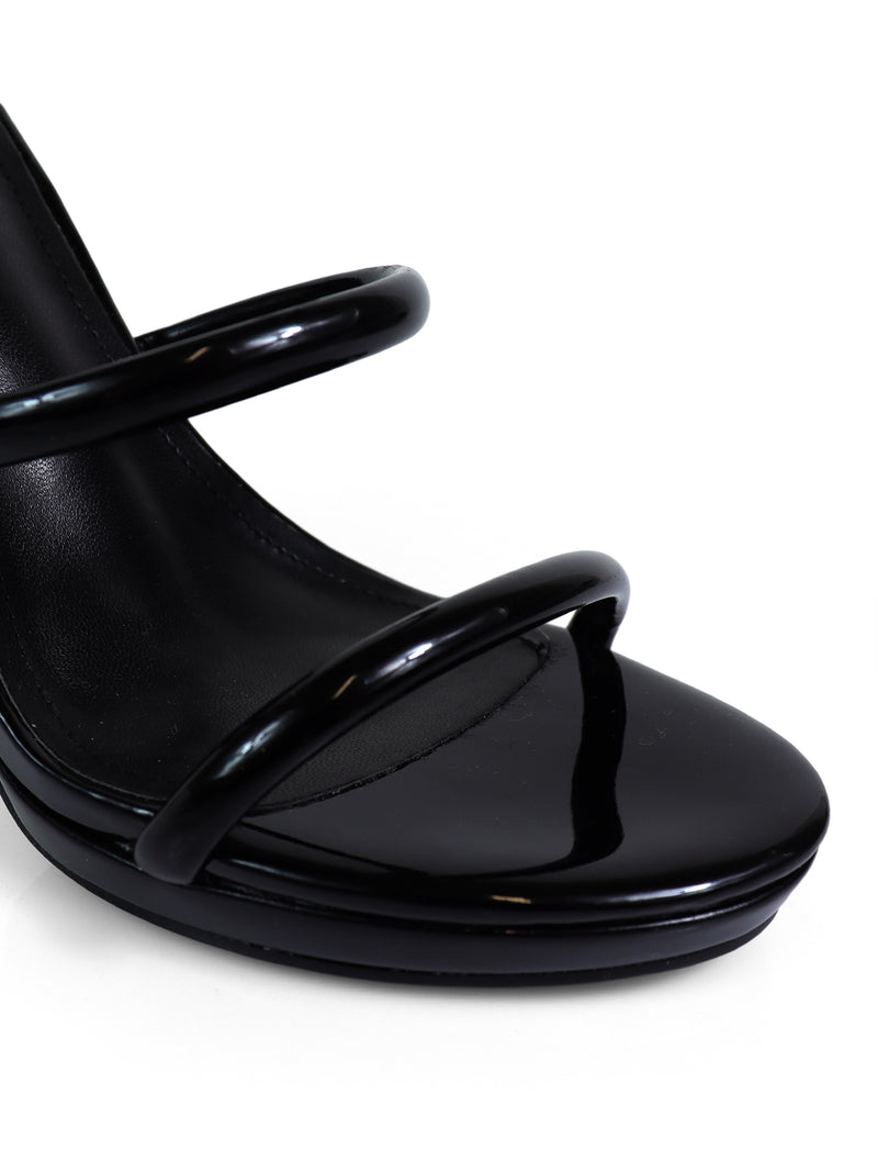 Close-up of the Sabine Round Toe Heel by Frederick's of Hollywood, a black high-heeled sandal featuring glossy rounded toe straps and a shiny finish—ideal for any versatile women's shoe collection.