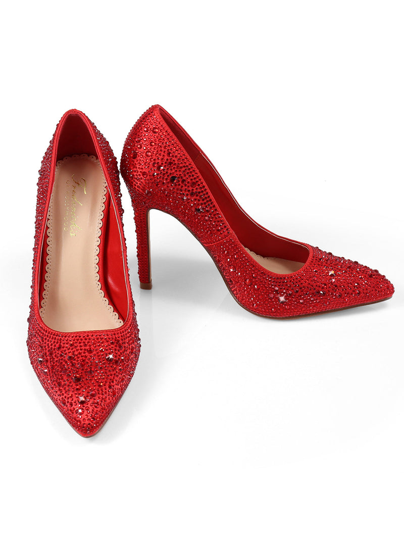 The Samantha Pump by Frederick's of Hollywood is a shiny red luxury heel adorned with sparkling rhinestones, displayed on a white background with one shoe upright and the other tilted.
