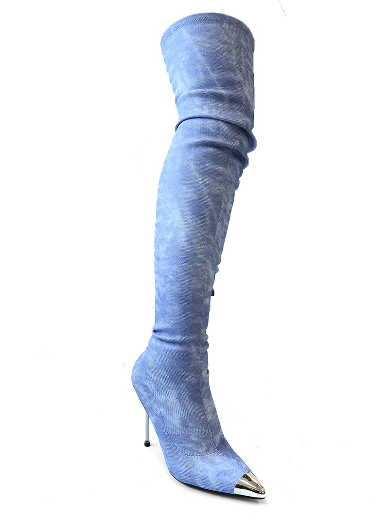 The Una Thigh High Boots by Frederick's of Hollywood are single, light blue suede stiletto boots featuring pointed toes and metallic silver toe caps, displayed against a white background.