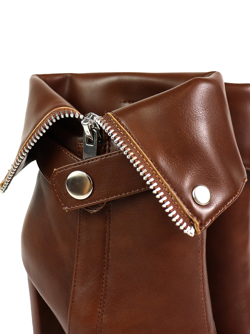 Close-up of Frederick's of Hollywood Yani Folded Ankle Boots in glossy brown leather, featuring a silver zipper, snap-button cuff, and a modern, sleek style.