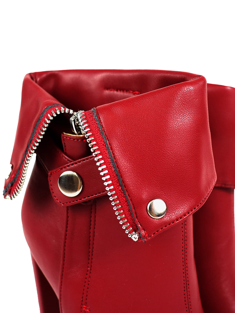 Close-up of Frederick's of Hollywood Yani Folded Ankle Boots in red leather, showcasing the cuff, silver zipper, and metallic snap buttons that emphasize the shoe’s modern design and detailed texture.