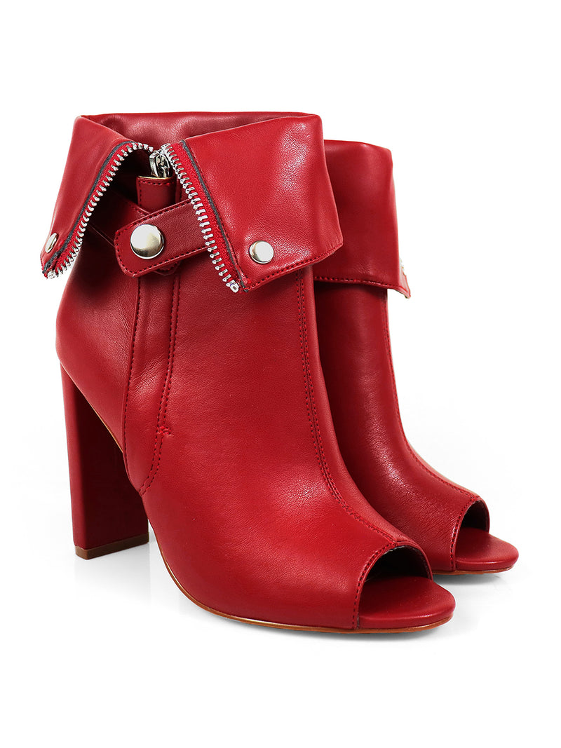 The Yani Folded Ankle Boots by Frederick's of Hollywood feature a stylish red design with high heels, cuffed detailing, silver snap buttons, a visible zipper, and an open toe for a modern flair.