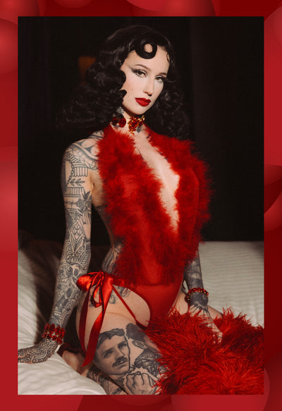 Model posing in red lingerie