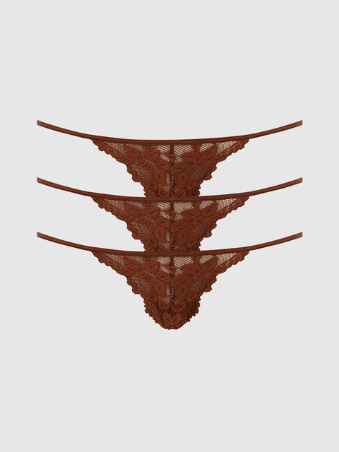 Three identical brown Jessica Lace Mini G-Strings from Frederick’s of Hollywood are stacked horizontally on a plain light gray background. This 3 Pack features floral lace details and thin side straps, perfect for lovers of stylish Panty Packs.