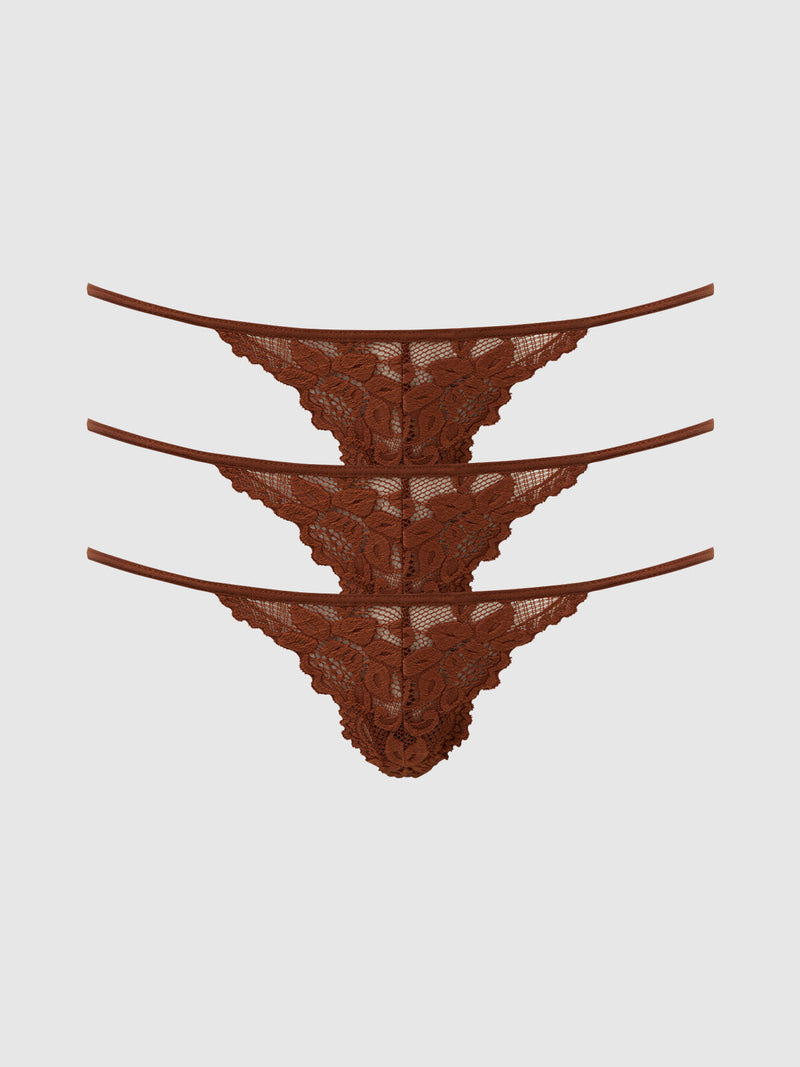 Three identical brown Jessica Lace Mini G-Strings from Frederick’s of Hollywood are stacked horizontally on a plain light gray background. This 3 Pack features floral lace details and thin side straps, perfect for lovers of stylish Panty Packs.