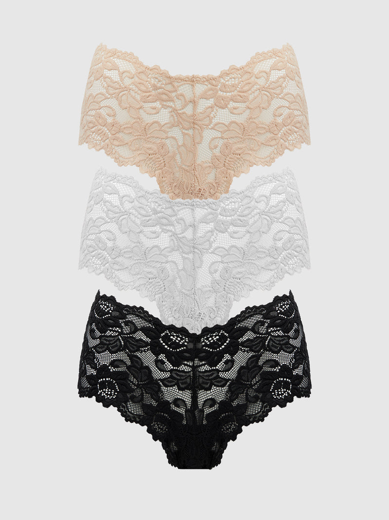 The Frederick's of Hollywood Jessica Lace Cheeky 3 Pack features three lace panties in nude, white, and black, stacked vertically on a plain background—a chic addition to your cheeky underwear collection.