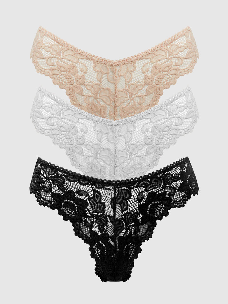 The Jessica Lace Tanga 3 Pack by Frederick's of Hollywood includes three chic minimal-coverage thongs in beige, white, and black—perfect everyday panties displayed overlapping on a light gray background.