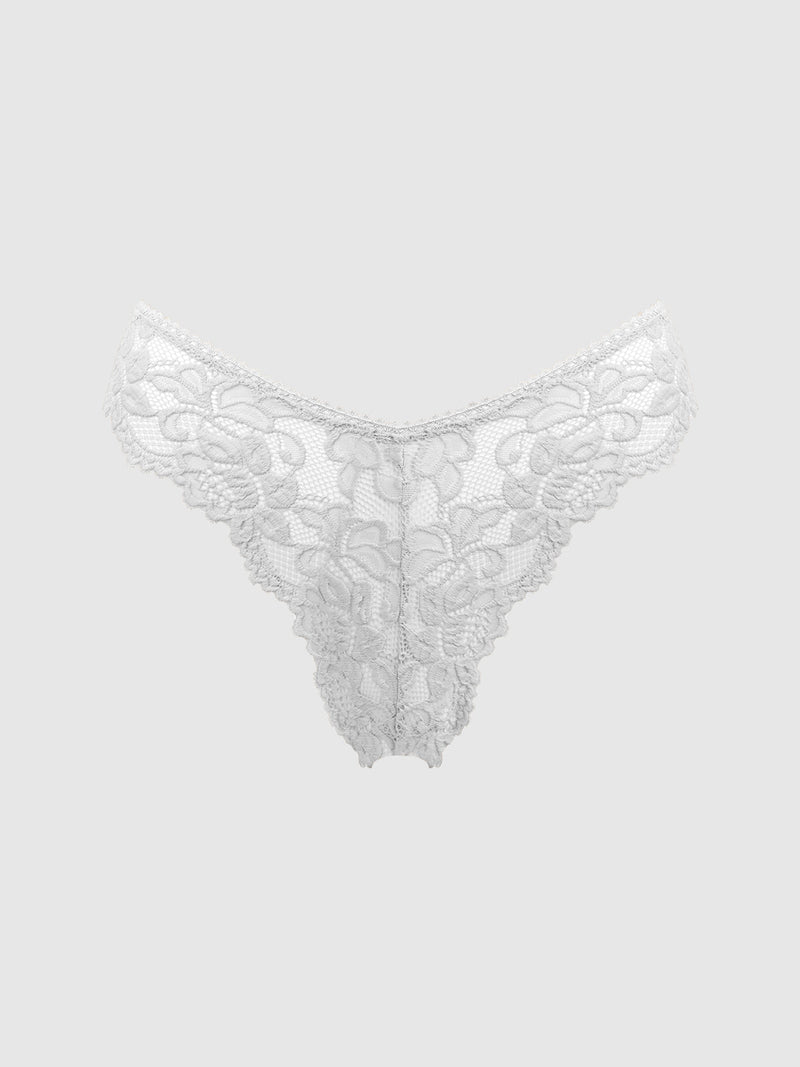 The Jessica Lace Tanga 3 Pack by Frederick's of Hollywood features white, floral-patterned, semi-sheer lace tangas with intricate detailing along the waistband and front, pictured against a plain light gray background.