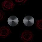 Silver circular earrings on a black background with red roses