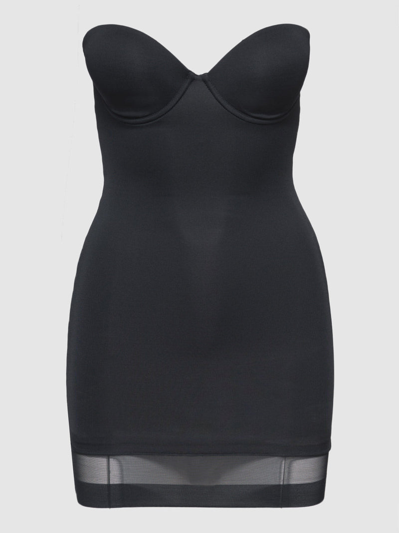 The Hollywood Shape Chemise by Frederick's of Hollywood is a black slip dress featuring built-in cups, a fitted silhouette, and a sheer mesh hem panel, shown against a plain white background.