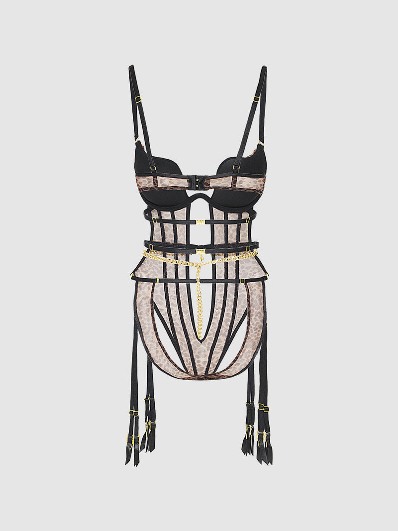The Alanza Swirl Plunge Push Up & Strappy Teddy by Frederick's of Hollywood features black and nude lace, gold accents, mesh panels, a push-up fit, and removable garters, shown on a plain light background.