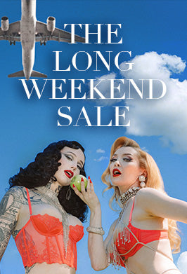 2 women in in lingerie with and airplane 