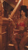 various women in lingerie, in different scenes throughout a haunted house of curiosities 