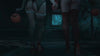 women in halloween lingerie costumes walking up to a haunted house holding hands 