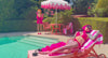 2 women in hot pink lingerie by a pool