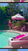 2 women in hot pink lingerie by a pool
