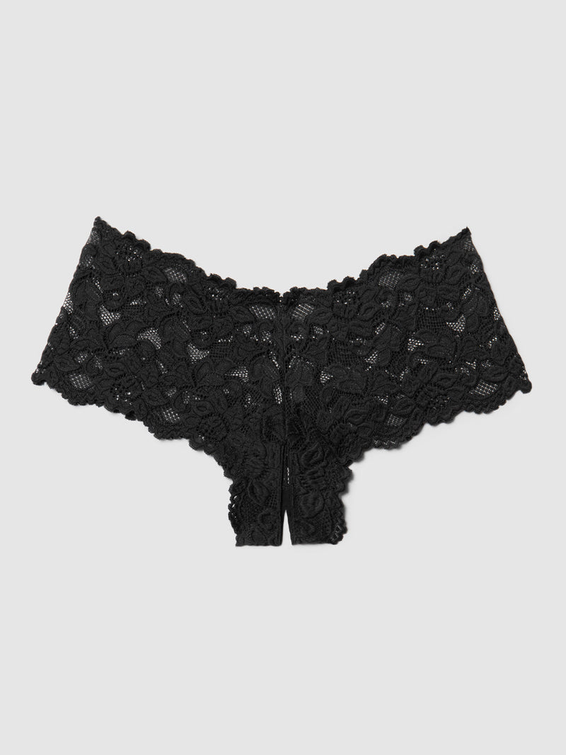 The Jessica Lace Crotchless Cheeky by Frederick's of Hollywood is black floral stretch lace lingerie with scalloped edges, a cheeky cut, and a small open detail at the front, shown flat on a plain light gray background.