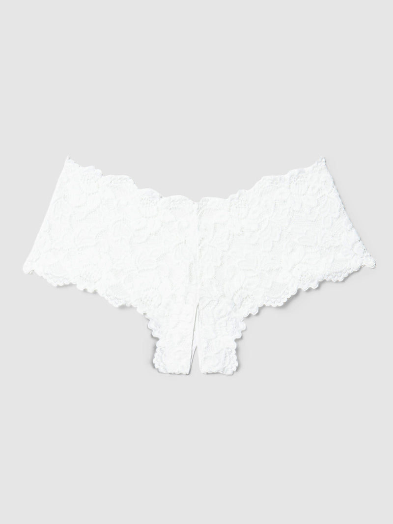 The Jessica Lace Crotchless Cheeky by Frederick's of Hollywood features white floral lace with scalloped edges and a cheeky cut, made from soft stretch lace, displayed flat on a light gray background.