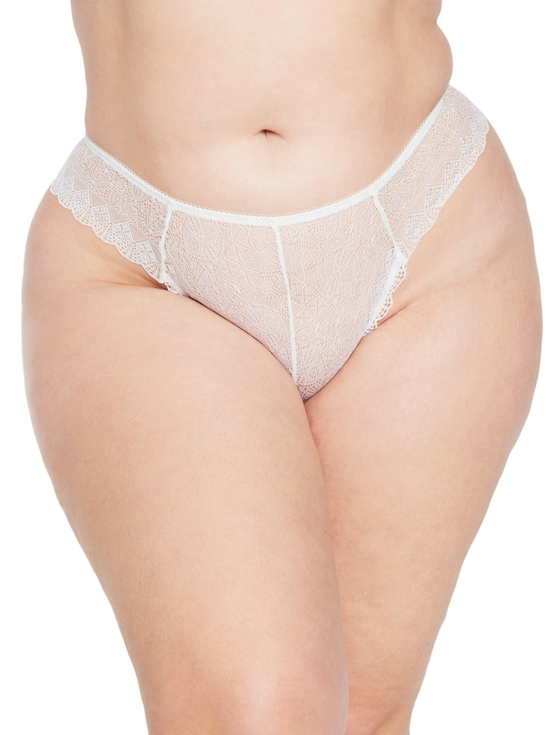 A close-up shows a person wearing the Frederick's of Hollywood Mariana Lace Thong, highlighting its delicate stretch geo lace pattern and high-waisted design with the midsection and upper thighs in view.