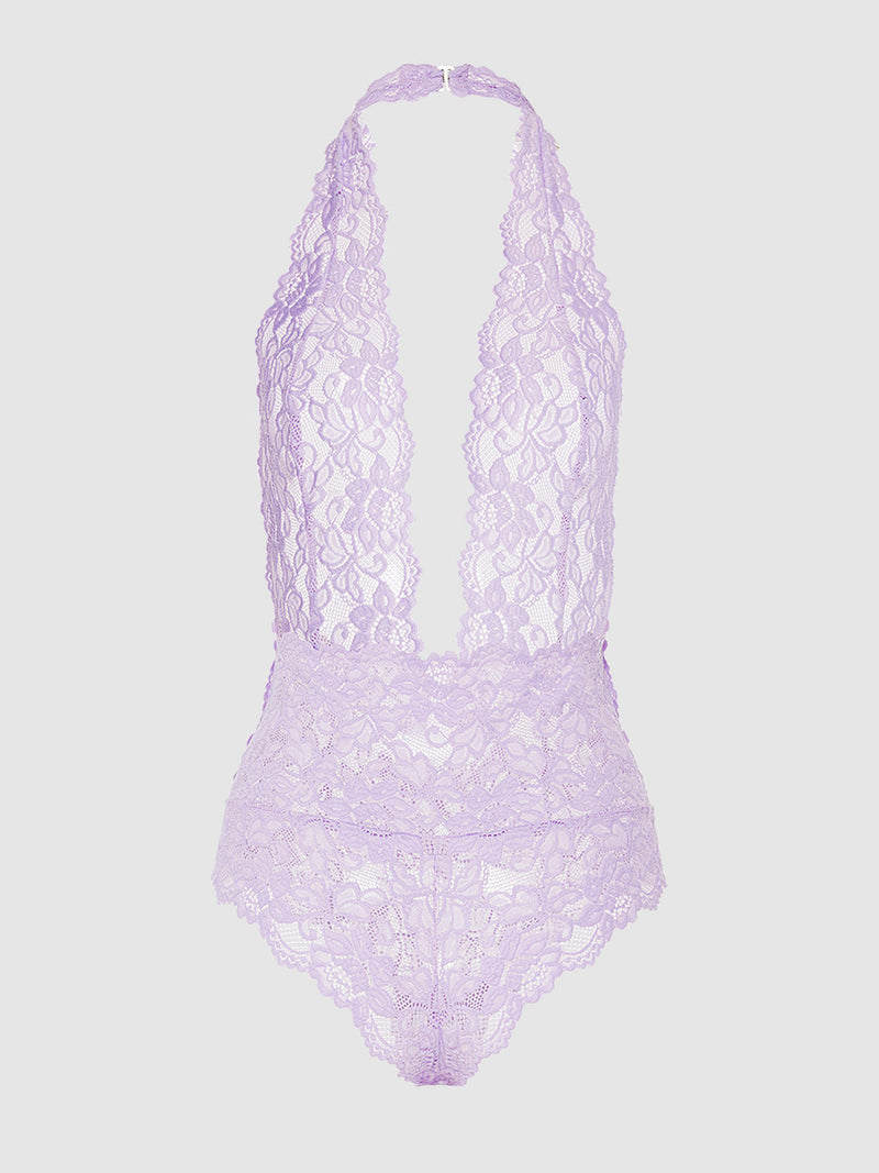 The Jessica Lace Teddy by Frederick's of Hollywood is a lavender halter bodysuit with a deep V neckline, scalloped edges, and floral lace details, shown on a plain light gray background.