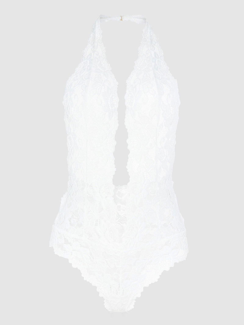 The Jessica Lace Teddy by Frederick's of Hollywood features a white halter-neck design with a deep plunge neckline and intricate floral lace, showcased against a plain light gray background.